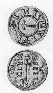 A VIKING COIN  showing Thor's hammer and a sword